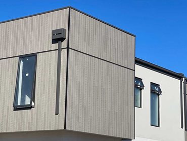 Cemintel Territory lightweight cladding was used for the first floors of the townhouses