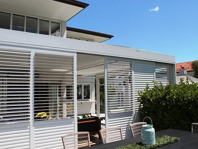 Exterior House View With LouvreTec White Shutters