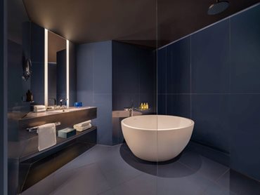 Corian® not only enhances the visual appeal of the bathrooms but also promotes a hygienic environment