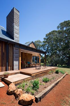 Rough-sawn spotted gum cladding to the exterior adds variety in tone and texture