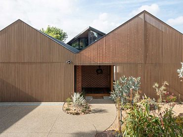 Ever Art Wood timber look battens reference the gable silhouette of the Camberwell home 