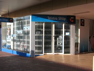 ATDC's expandable security gates protect a Telstra Shop 