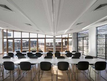 Lighting, vents and access panels were seamlessly integrated into the ceiling design