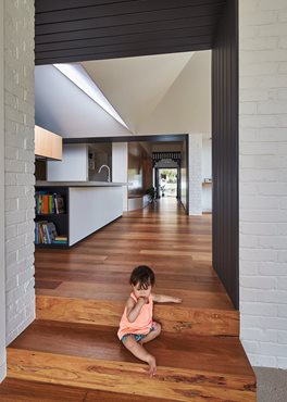Opening up the existing house with a roof that lifts, dips, shades and illuminates, natural light is reintroduced to the darker corners of the house 