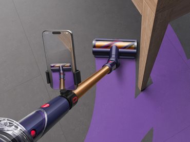 The CleanTrace hardware is a phone clamp, which attaches to the vacuum wand, allowing the owner’s phone camera to see the clean path 