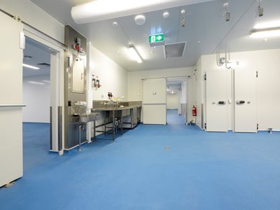 Interior of healthcare operating room with blue resin-based flooring 