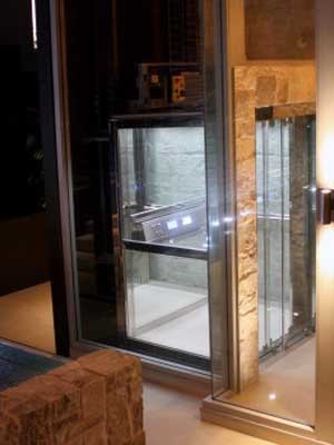 The Supermec 3 lift in polished stainless steel and glass
