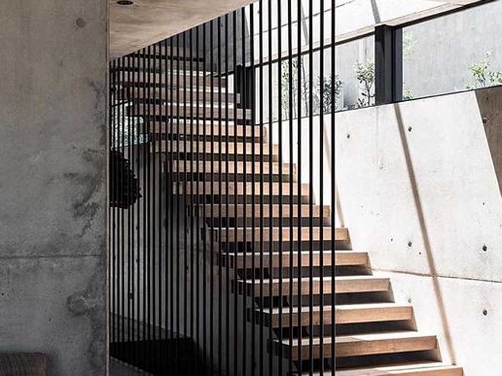 Floor-to-ceiling post balustrades by Studio Black Interiors