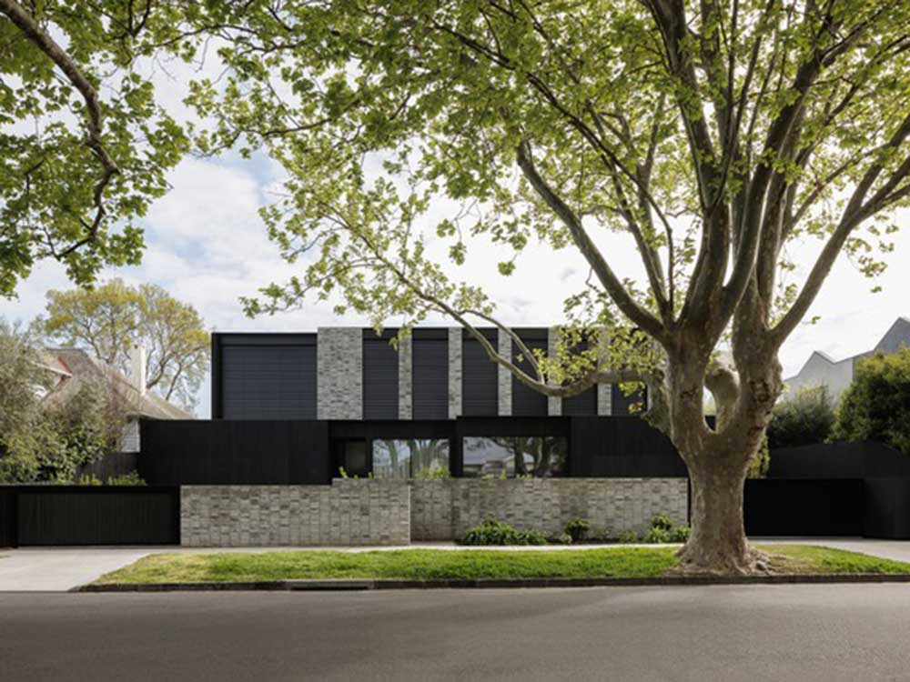 The Elsternwick Residences featuring a brick and charred timber facade