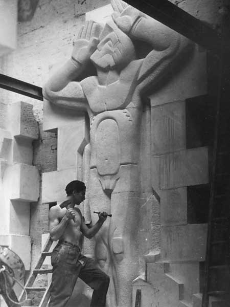 The figure &#39;Architectural Aspiration&#39; is carved at the new RIBA headquarters in London (1934)
