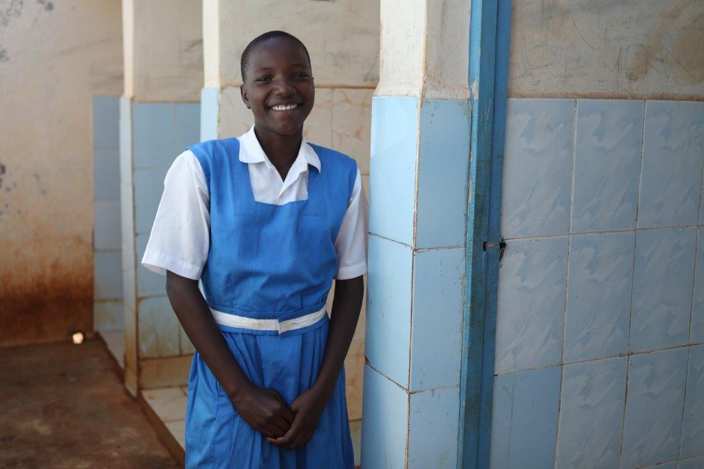 Keynan-kid-at-school-in-front-of-the-toilet-C-UNICEF-Kenya-2015-Vidyarthi-1.jpg