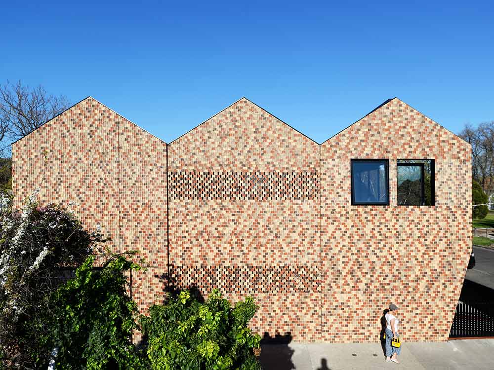 External facade of residential building with non-combustible clay bricks