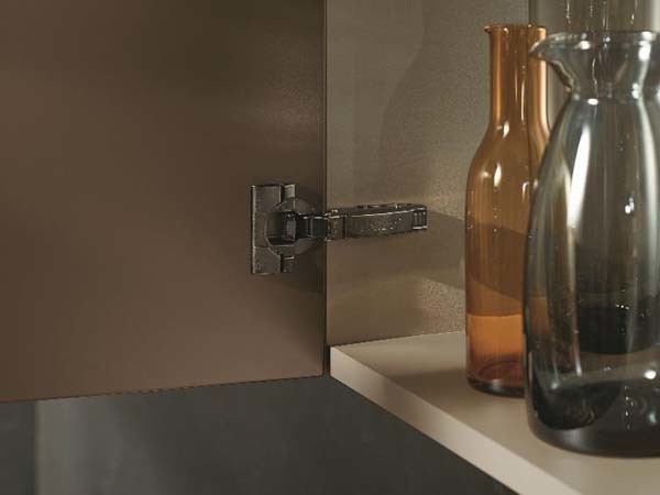 CLIP top BLUMOTION in Onyx Black integrates harmoniously into darker cabinets. (Photo by Blum)
