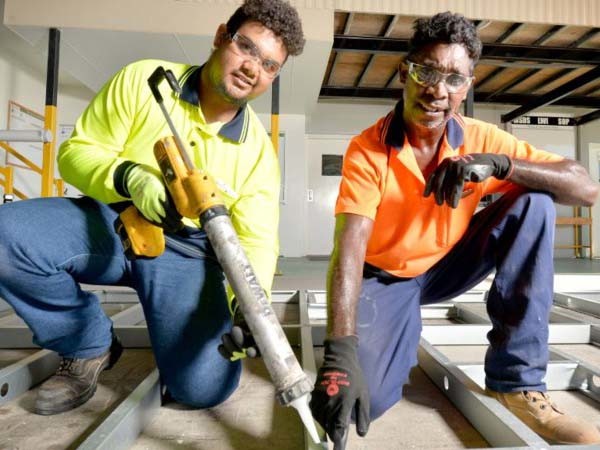 Ausco first year apprentice Fredrick McGilbary (left) being shown the ropes by Gus Logan. Photo courtesy of the Courier Mail

