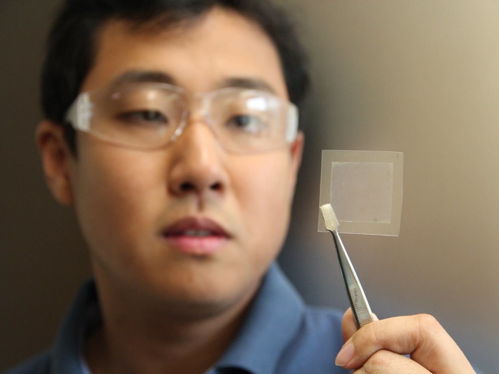 CSIRO Scientist Dr Dong Han Seo, co-author of the study, holds a piece of graphene film
