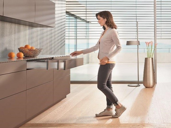 TIP-ON BLUMOTION brings enhanced user convenience to kitchens with handle-less fronts. (Photo by Blum)
