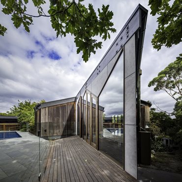 New kids living room opens out onto renovated swimming pool. Photography by Andrew Latreille