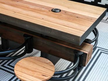 Custom solid timber furniture, timber planters and cantilevered stools were hand-welded and finished with reclaimed blackbutt timber by Maxton Fox