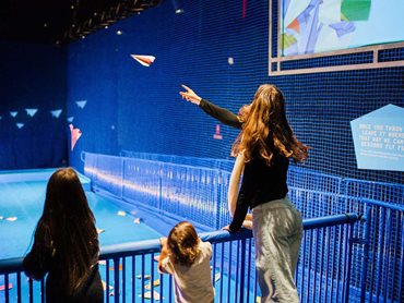 All exhibition visitors could easily imagine themselves up in the great blue yonder as they launched their crafty paper airplanes down the runway