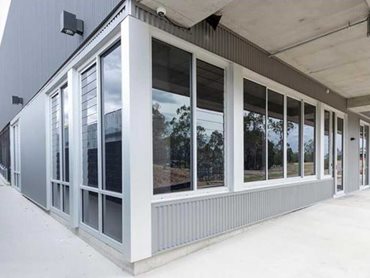 Breezeway louvre galleries and View-Max commercial sliding windows integrated seamlessly with McArthur Evo 101.6 and 150mm centre pocket framing systems