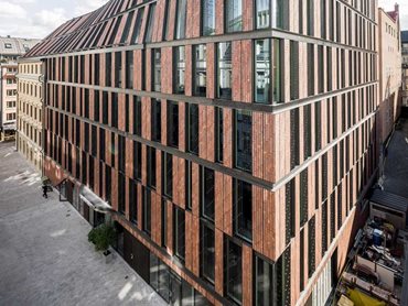 The new office building features a special edition of Kolumba bricks, 800mm long, in a deep, rusty red