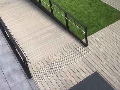 Synthetic turf next to ramp in outdoor area