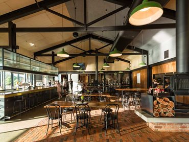 The walls of the main restaurant and whiskey bar are lined with Armourpanel in Spotted Gum