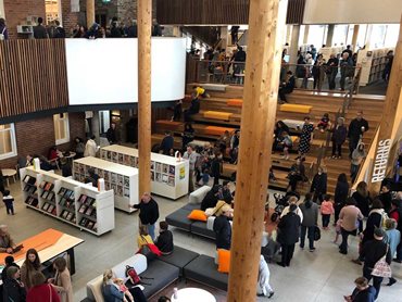 The timber columns provide an open space feeling inside the library 