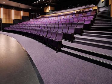 The carpet colour needed to extend a visual connectivity to the auditorium foyer finishes