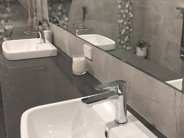 Double hand basins allow more than one person to use the bathroom at the same time