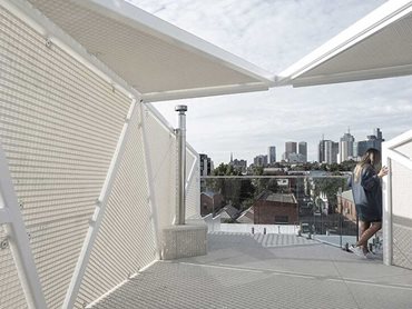 Faceted steel frame and FRP perforated panels provide shade and ensure privacy 