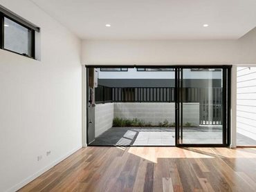 Carinya Classic sliding doors provide access to the individual garden courtyard areas of the townhouses