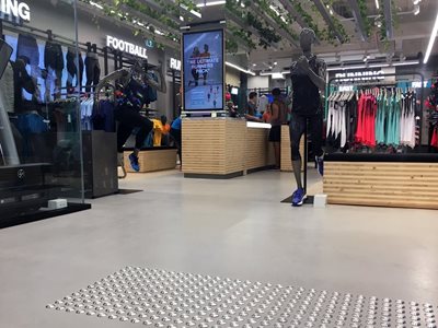 Interior of apparel retail store featuring resin flooring