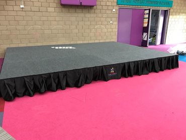 DIVA Fold & Roll Stage at Tuart Forest Primary School featuring the school's logo on the valance 