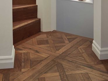 The Antique Rustic Versailles floor helps to reintroduce a sense of place and history in the home
