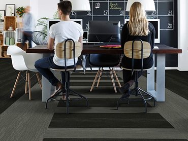 Office interior with workstation sustainable carpet tiles