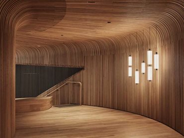 Steam-bent timber battens developed by Sculptform were used to create the undulating curved ceiling