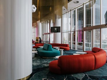 Plus Architecture’s vision for the Atrium Bar comes to life with organic curved forms, pops of bright colours, luxurious materials and playful elements