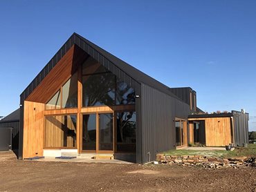 Exterior facade view of Paarhammer windows doors in residential home