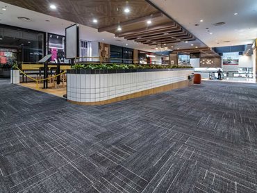 Fusion carpet planks in a retail setting provide low maintenance flooring with excellent noise insulation