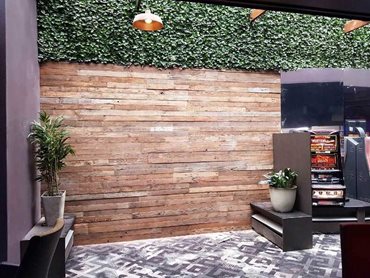 A recycled timber feature wall made with wire brushed panels 