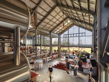 The hospitality and public spaces are wrapped around the brewing process to enhance the guest’s experience