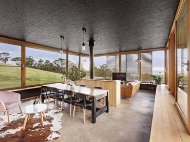 Floor to ceiling glazed windows on all sides of the home capture the amazing views of the natural landscape