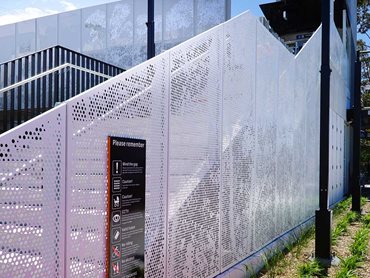 Towradgi Station: Custom perforated, nature-themed aluminium footbridge panels