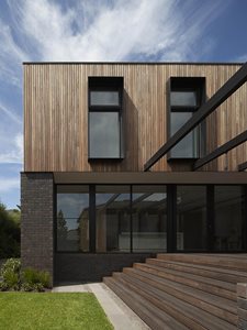 exterior facade dark brown brick timber slats black aluminium