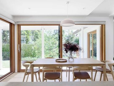 Glazed sliding doors create a comfortable connection between the indoor and outdoor spaces for dining and entertaining 