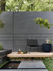 Outdoor deck with through coloured fibre cement cladding
