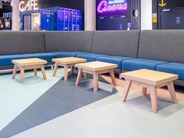 The floor forms a strong element of the design, helping to define the cafe 
