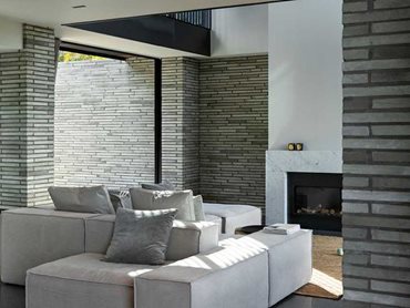 Downstairs is for family and friends and the hero material is Petersen bricks, creating contrast and character inside and out