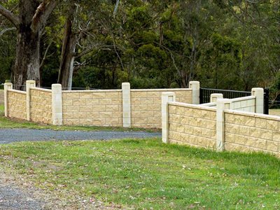 Park with boundary concrete masonry fence system